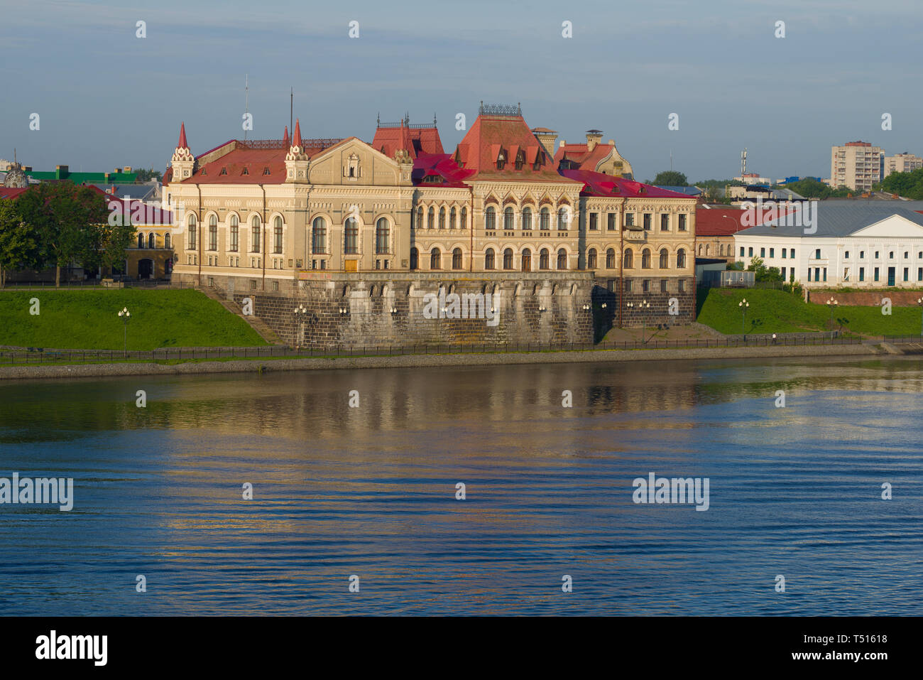View of the ancient building (1912) of the grain exchange on the Volga embankment on a July morning. Rybinsk, Russia Stock Photo