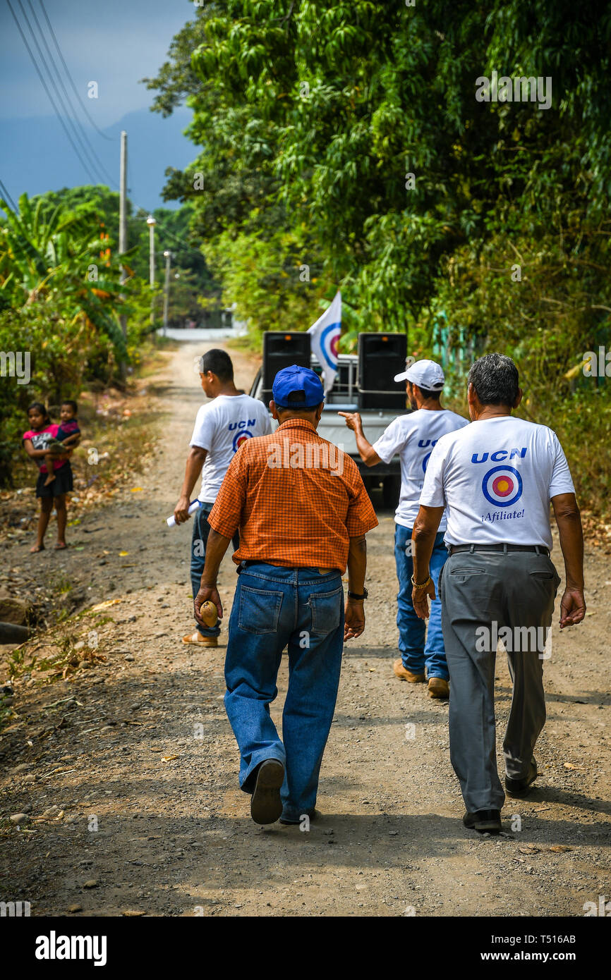 guatemalan-political-group-passing-out-flyers-in-poor-village-stock