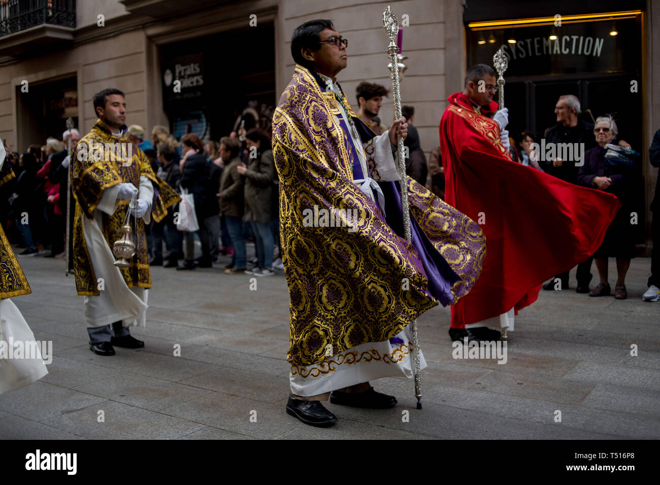The wind blows the robes of the priests during the Good Friday procession in Barcelona. Stock Photo