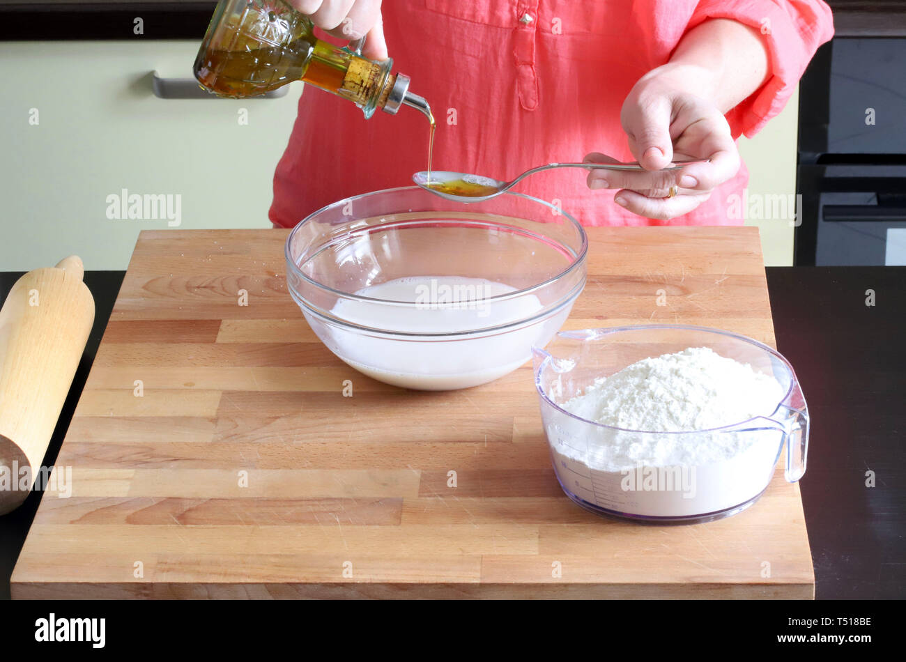 hands woman preparing yeast dough Stock Photo