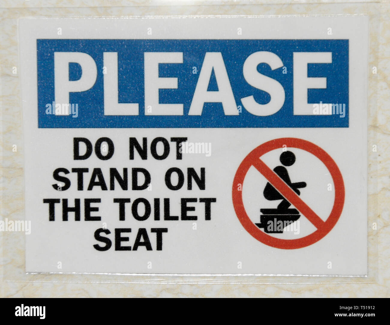 Sign warning user not to stand on toilet seat Stock Photo