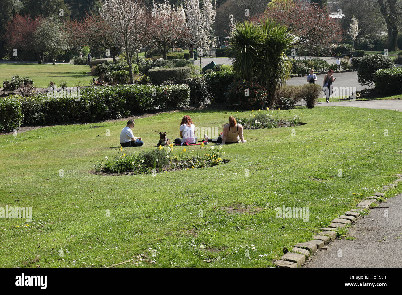Haworth, West Yorkshire, 19th April 2019 Locals and tourists in the park enjoying the Good Friday holiday break in the sunshine. Stock Photo