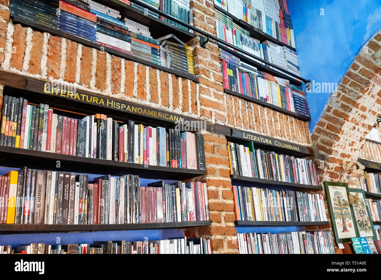 Cartagena Colombia,Abaco Libros y Cafe,Abacus bookstore cafe,interior inside,bookshelf,Latin American literature,books,sign,Spanish language,COL190123 Stock Photo
