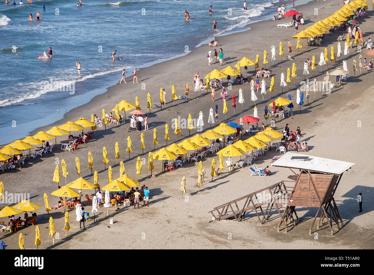 Cartagena Colombia,Bocagrande,Caribbean Sea public beach,sand water,umbrellas yellow rental,Hispanic resident residents,waves,unoccupied,crowded toget Stock Photo