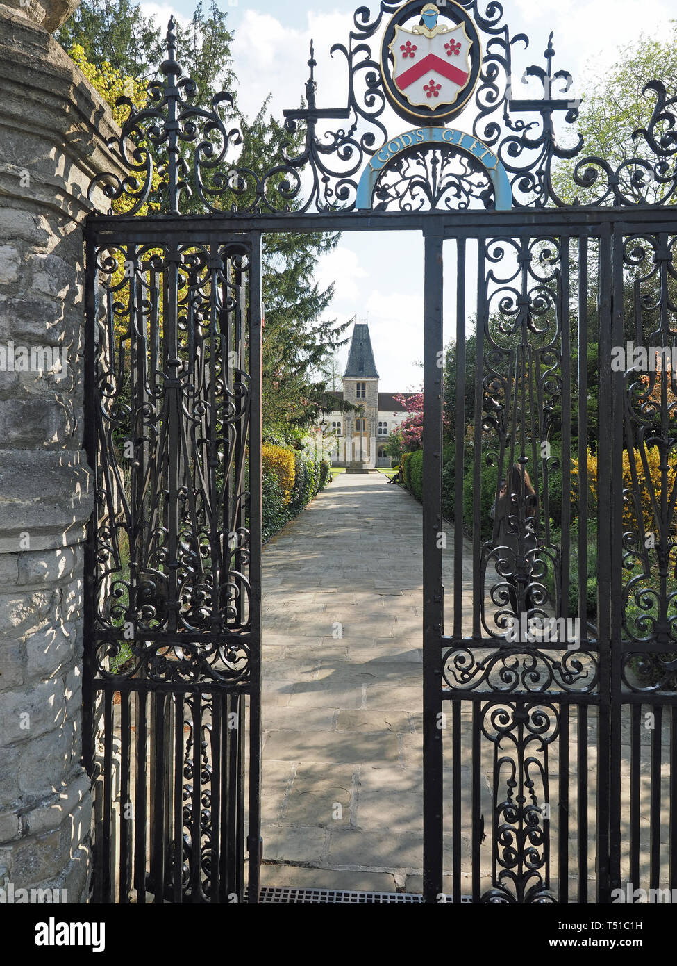 View looking through the iron entrance gate to Christ's Chapel of God's Gift at Dulwich Village in London Stock Photo