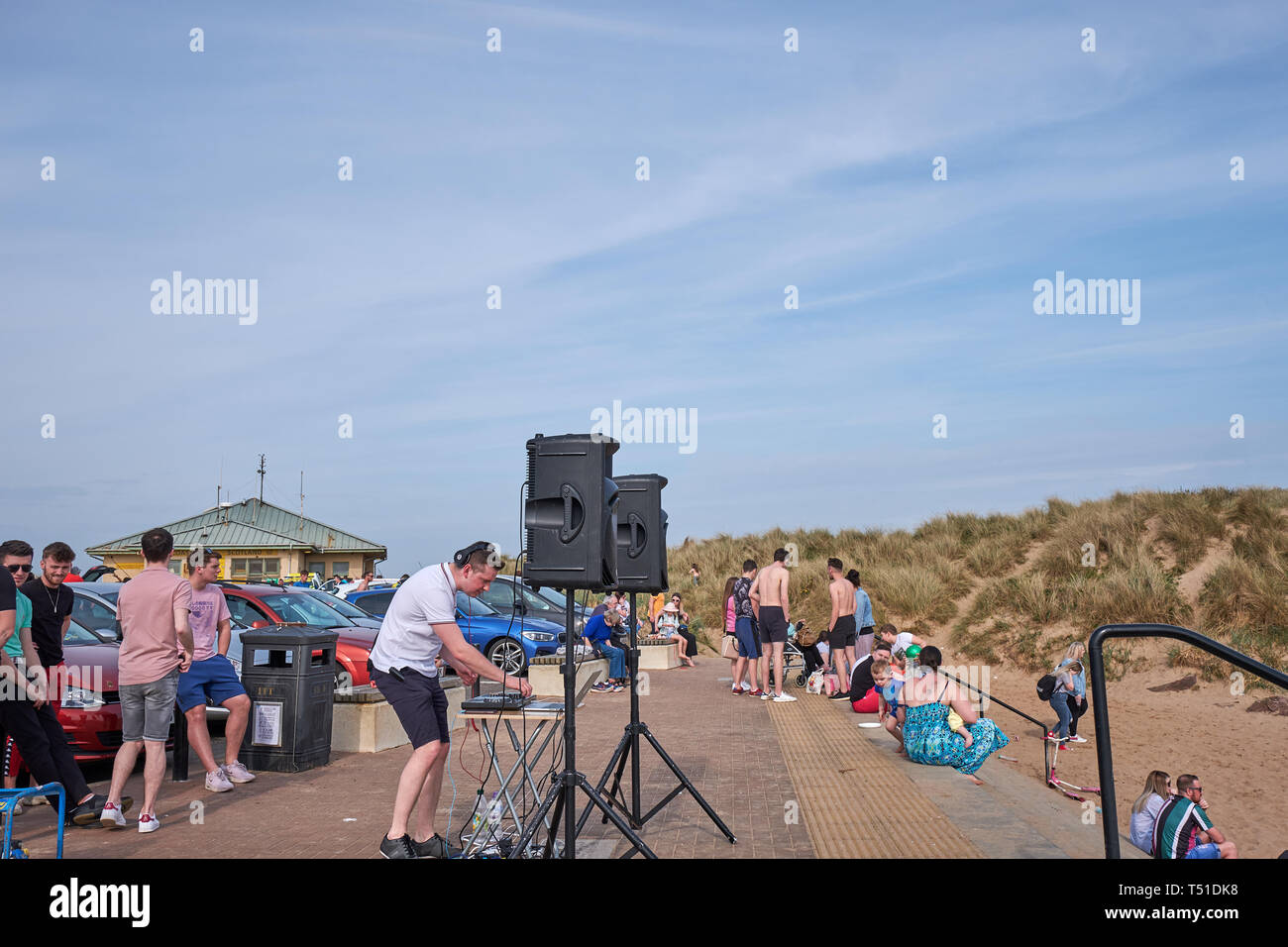 Young stylish man posing behind mixing console Irvine Beach -Gailes Beach-North Ayrshire, Scotland Stock Photo