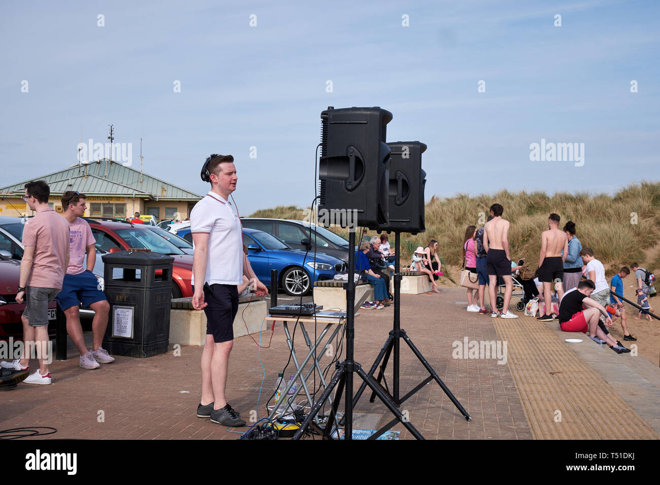 Young stylish man posing behind mixing console Irvine Beach -Gailes Beach-North Ayrshire, Scotland Stock Photo