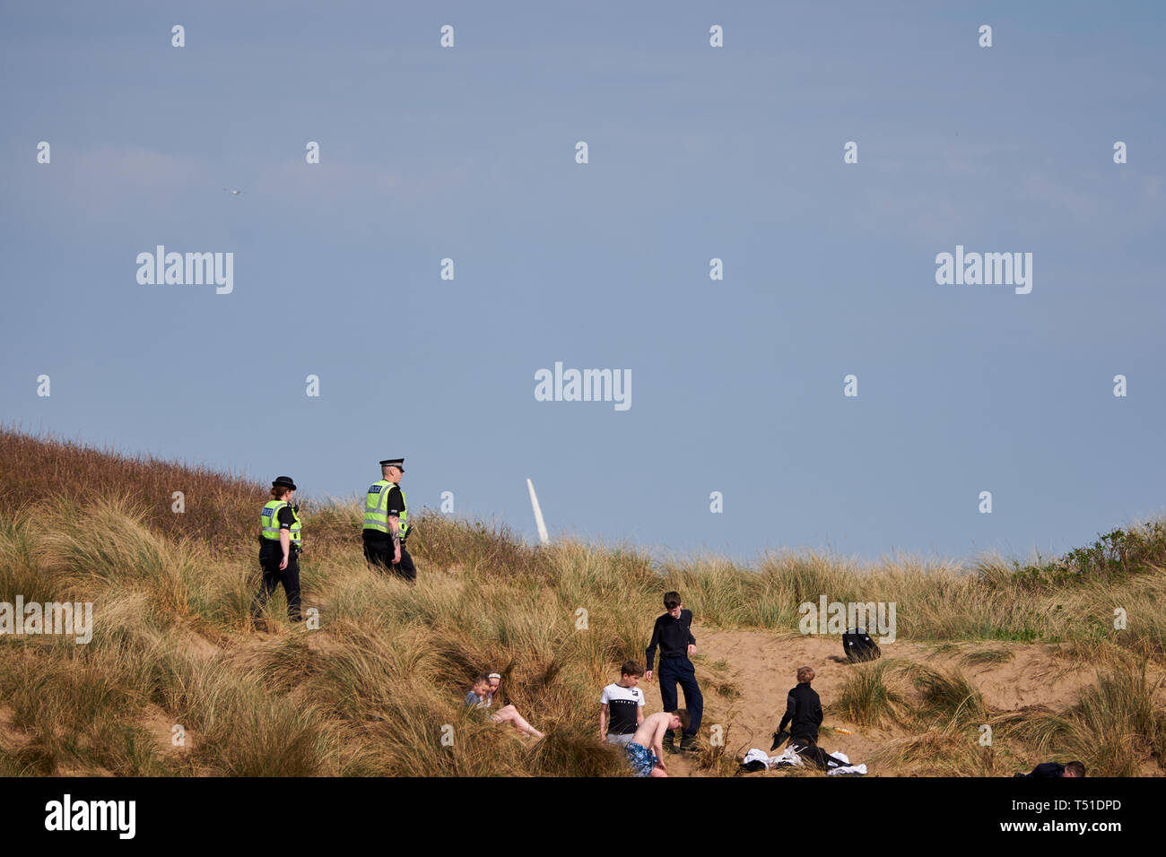 Policemen patrolling the dunes Irvine Beach -Gailes Beach-North Ayrshire, Scotland Stock Photo