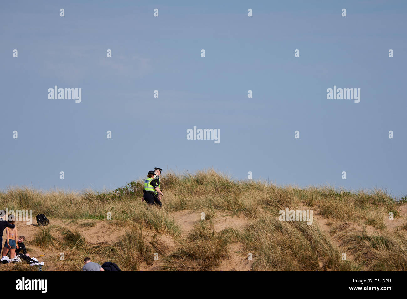 Policemen patrolling the dunes Irvine Beach -Gailes Beach-North Ayrshire, Scotland Stock Photo