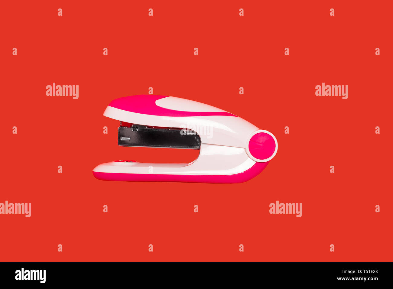 stapler on a red background Stock Photo