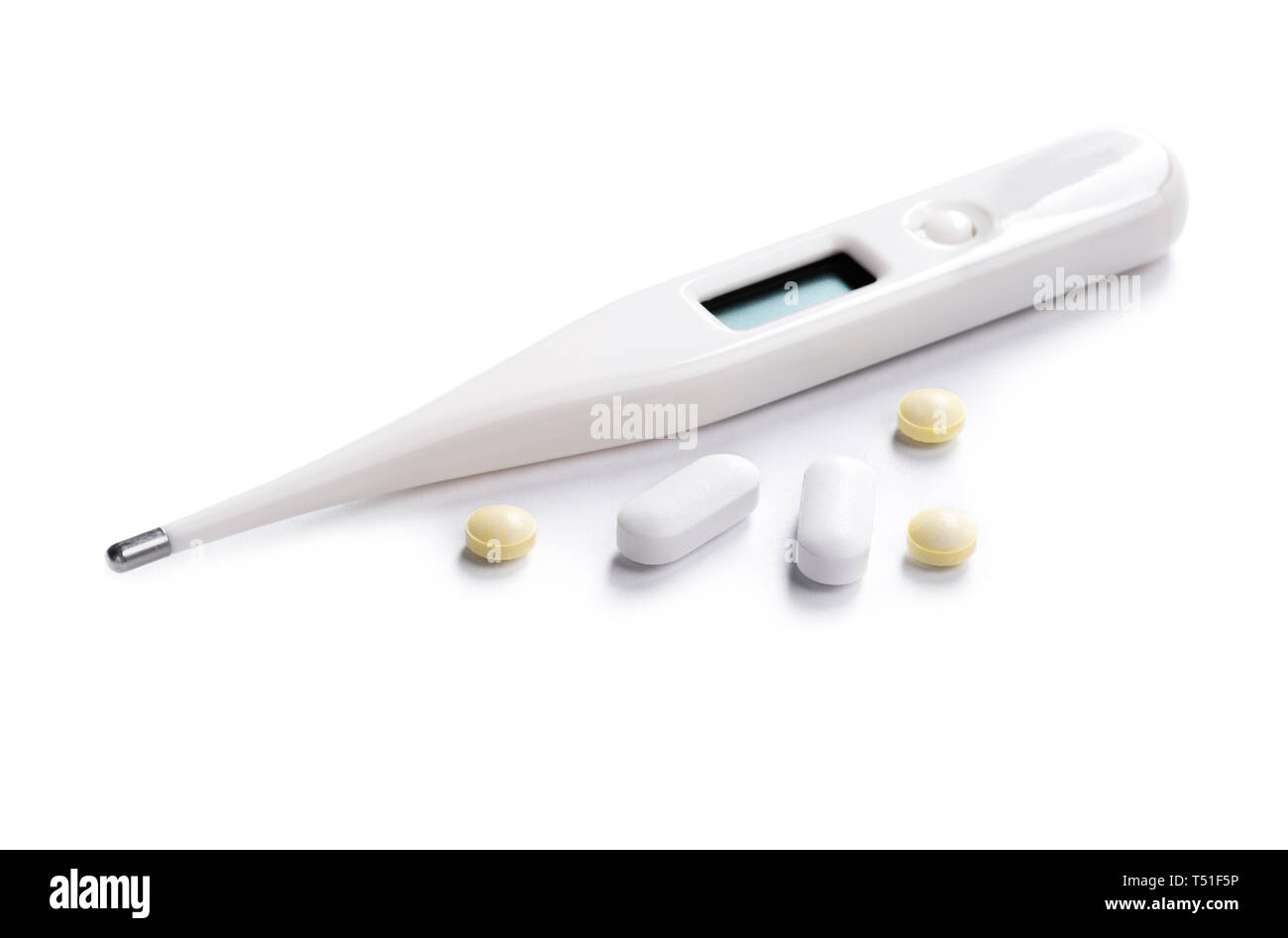 Digital thermometer and pills on white Stock Photo