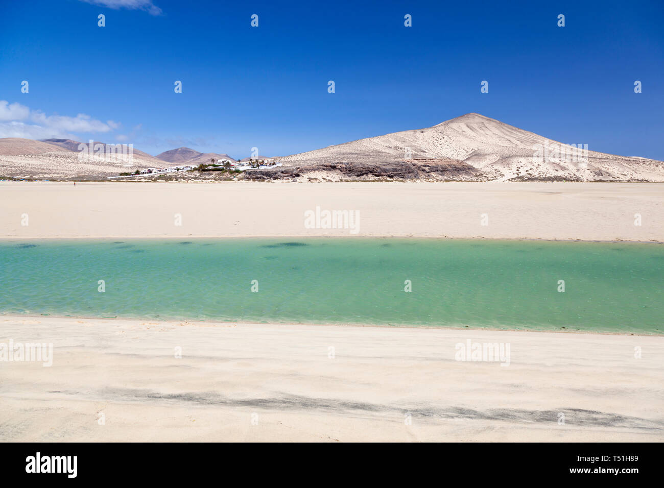 Beach and lagoon at Playas De Sotavento near Risco El Paso. The lagoon is at Playa Barca. Stock Photo