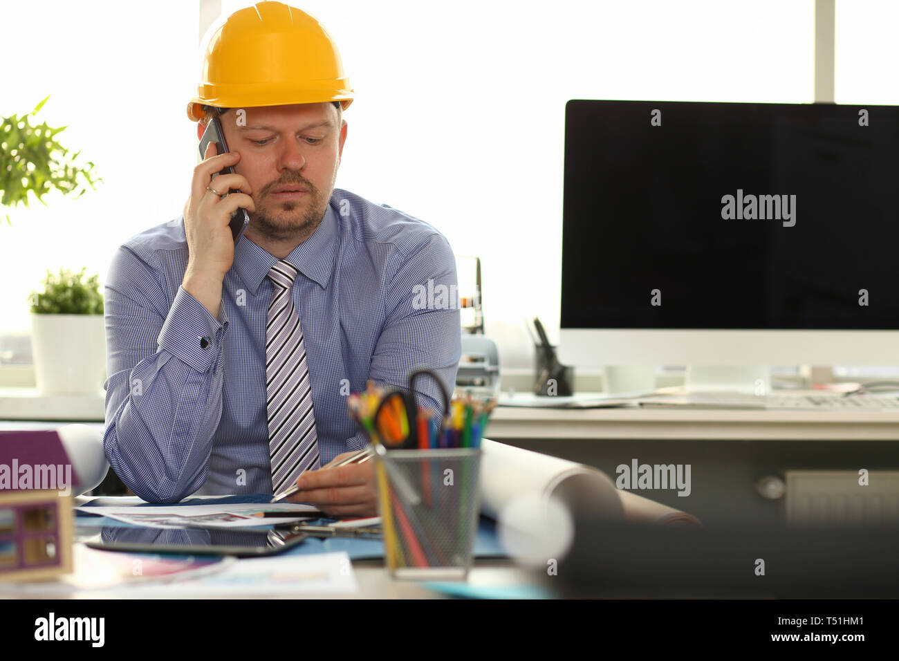 Civil engineer male hard hat phone hi-res stock photography and images ...