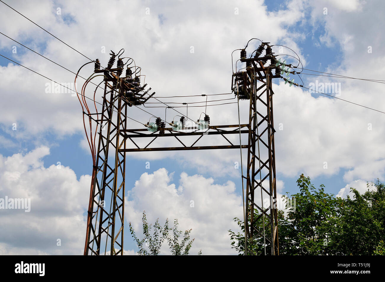 Electricity high voltage pole and the blue and cloudy sky Stock Photo ...