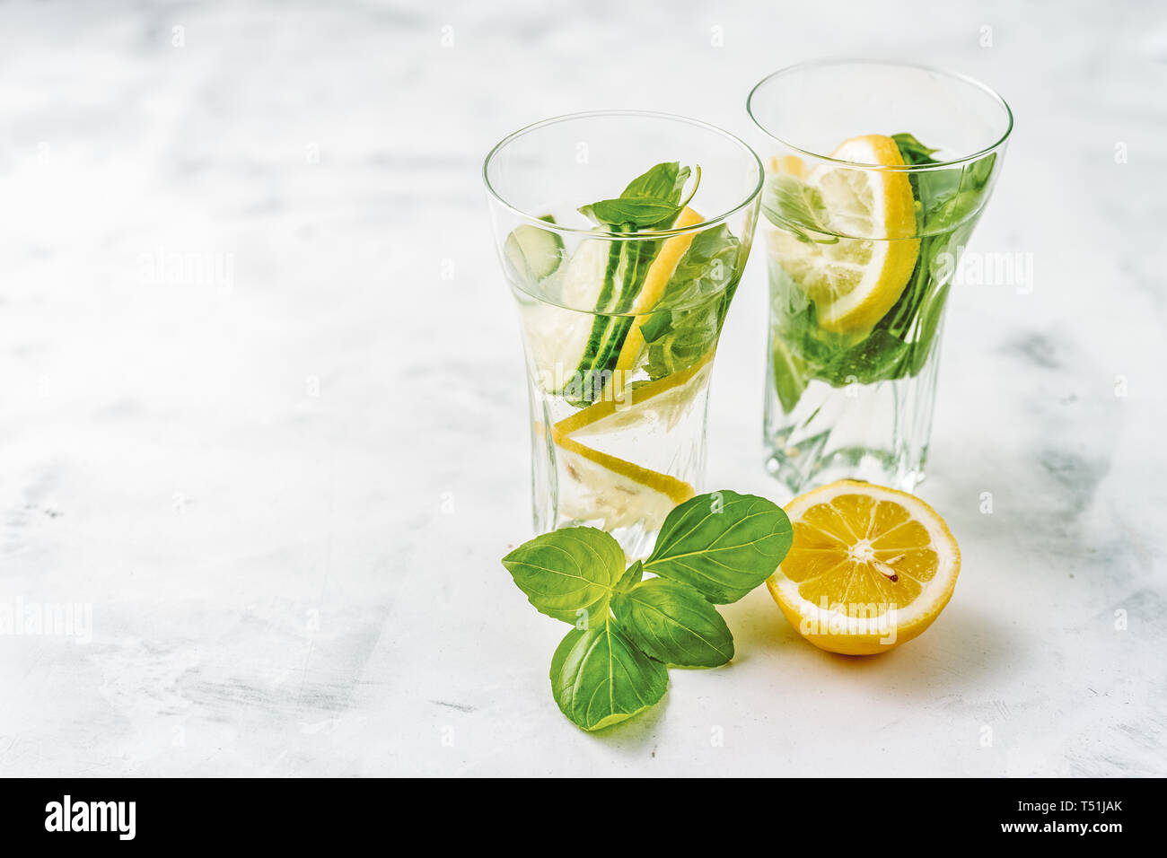 Infused water with lemon, cucmber and basil Stock Photo