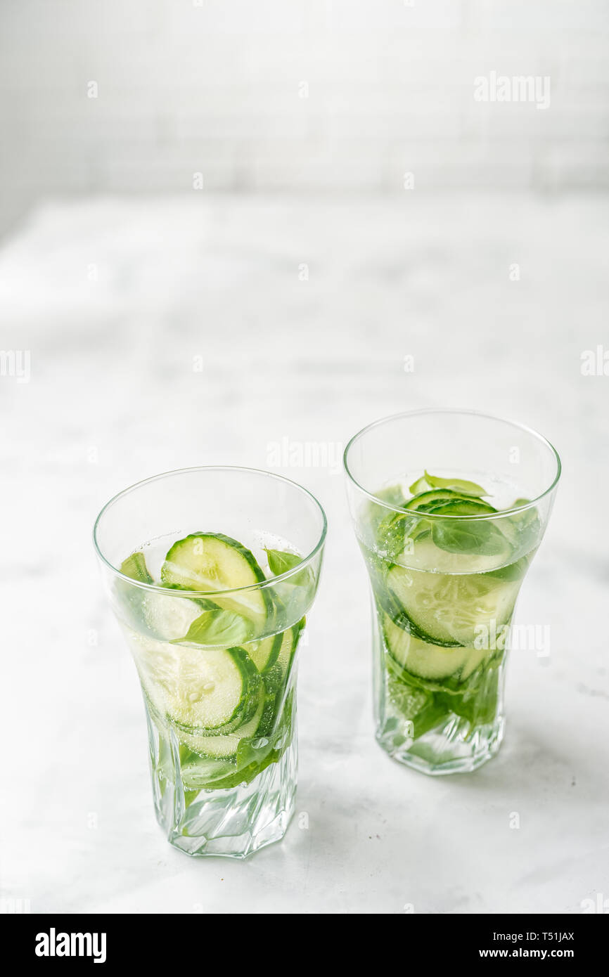 Detox infused water with cucumber and basil Stock Photo