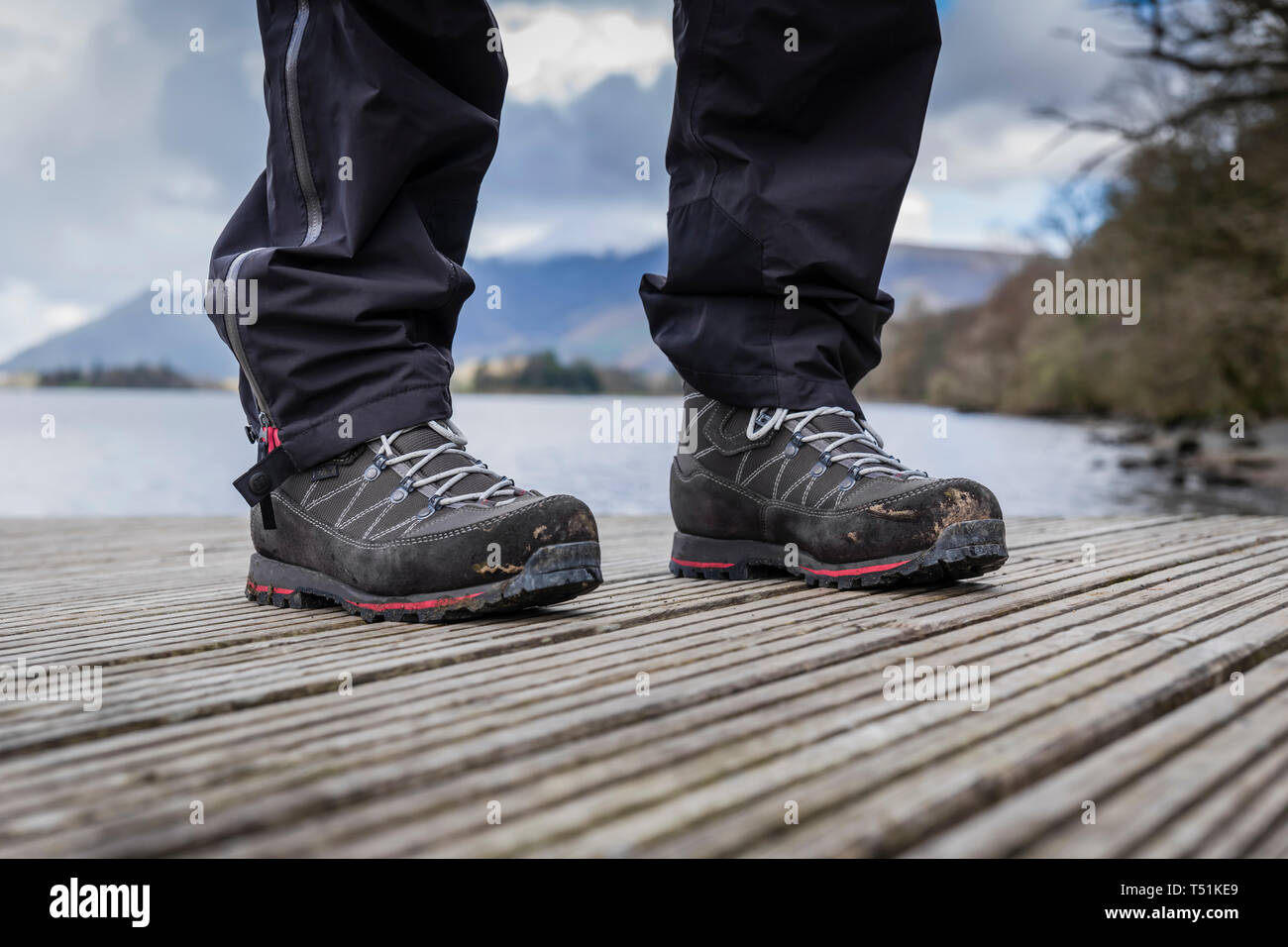 Walking boots on Ashness landing stage, Cumbria, UK. Stock Photo