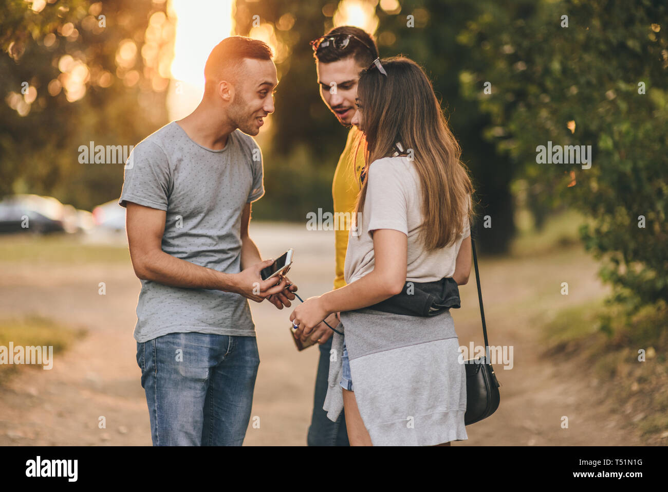 Two female friends making hand gestures in car Stock Photo. 