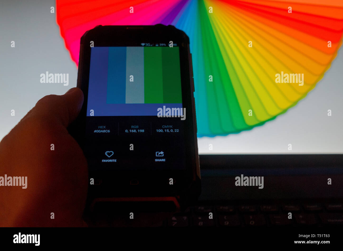 Electronic color palettes between a smartphone and a laptop Stock Photo ...