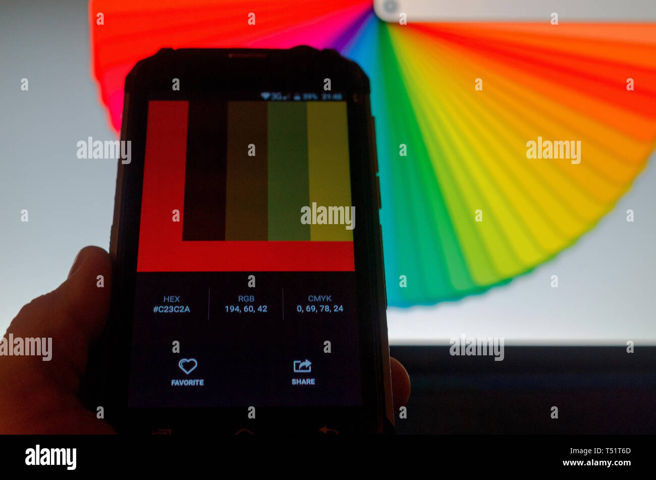 Electronic color palettes between a smartphone and a laptop Stock Photo
