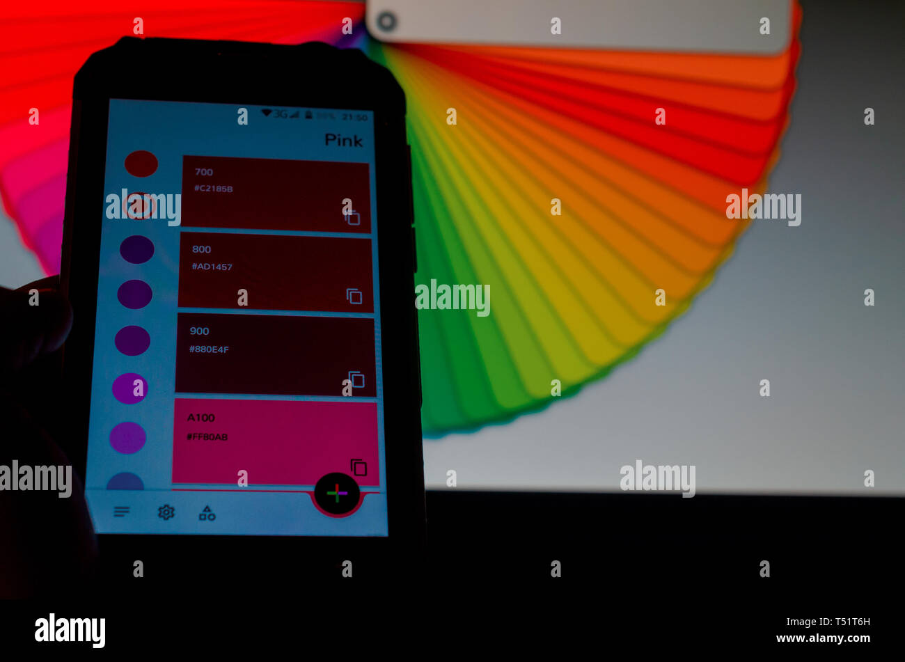 Electronic color palettes between a smartphone and a laptop Stock Photo