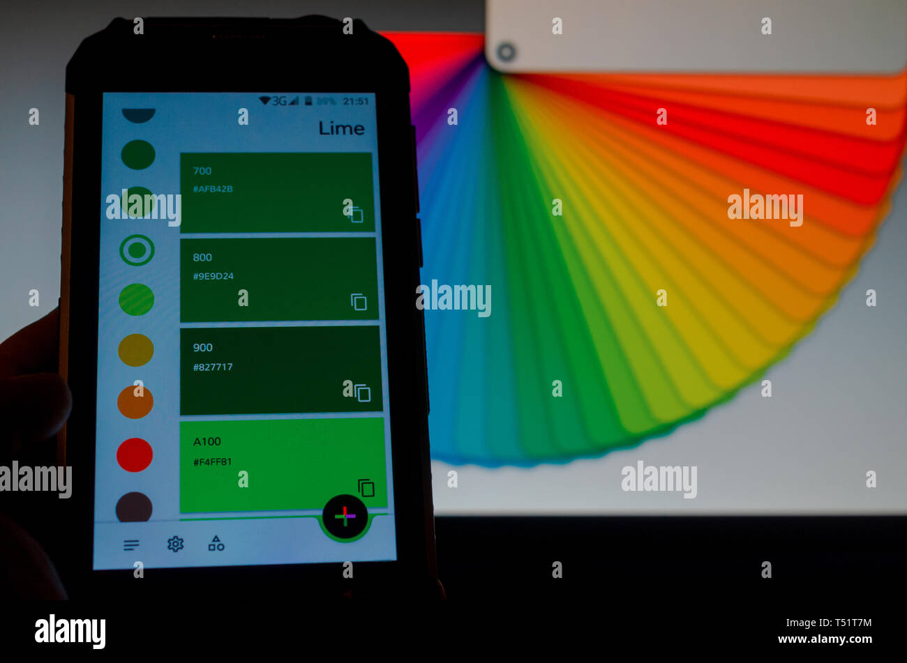 Electronic color palettes between a smartphone and a laptop Stock Photo