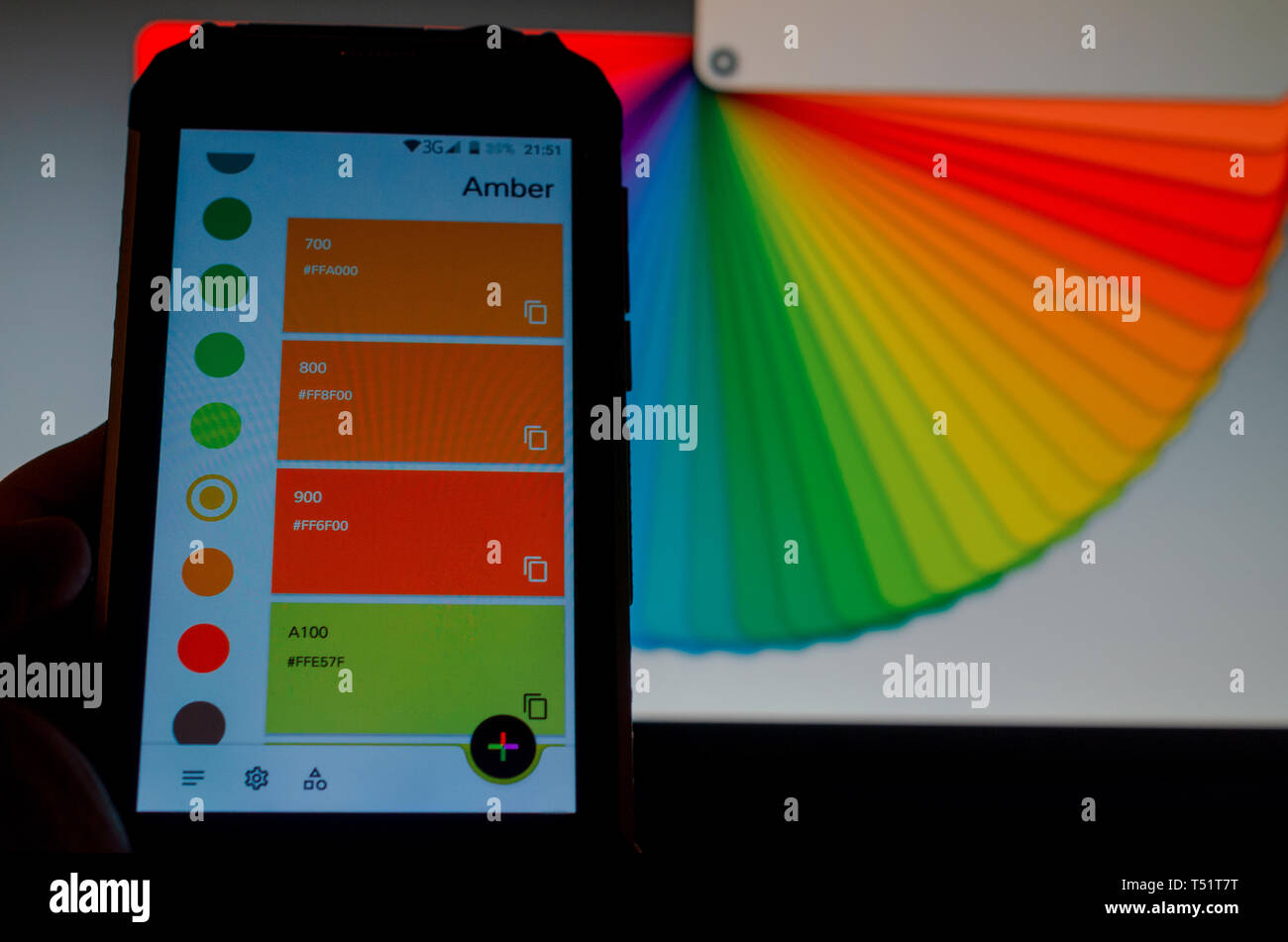 Electronic color palettes between a smartphone and a laptop Stock Photo