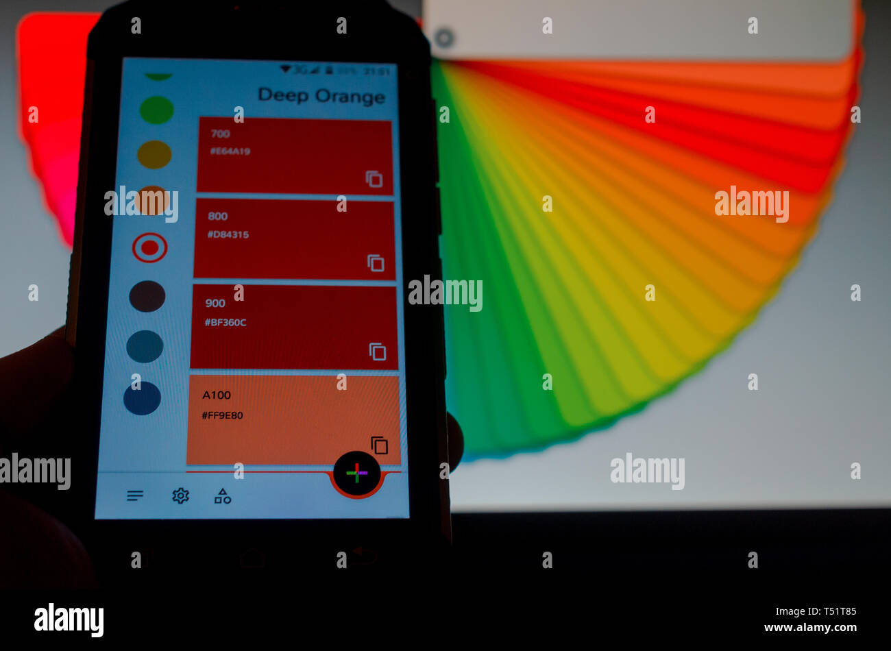 Electronic color palettes between a smartphone and a laptop Stock Photo