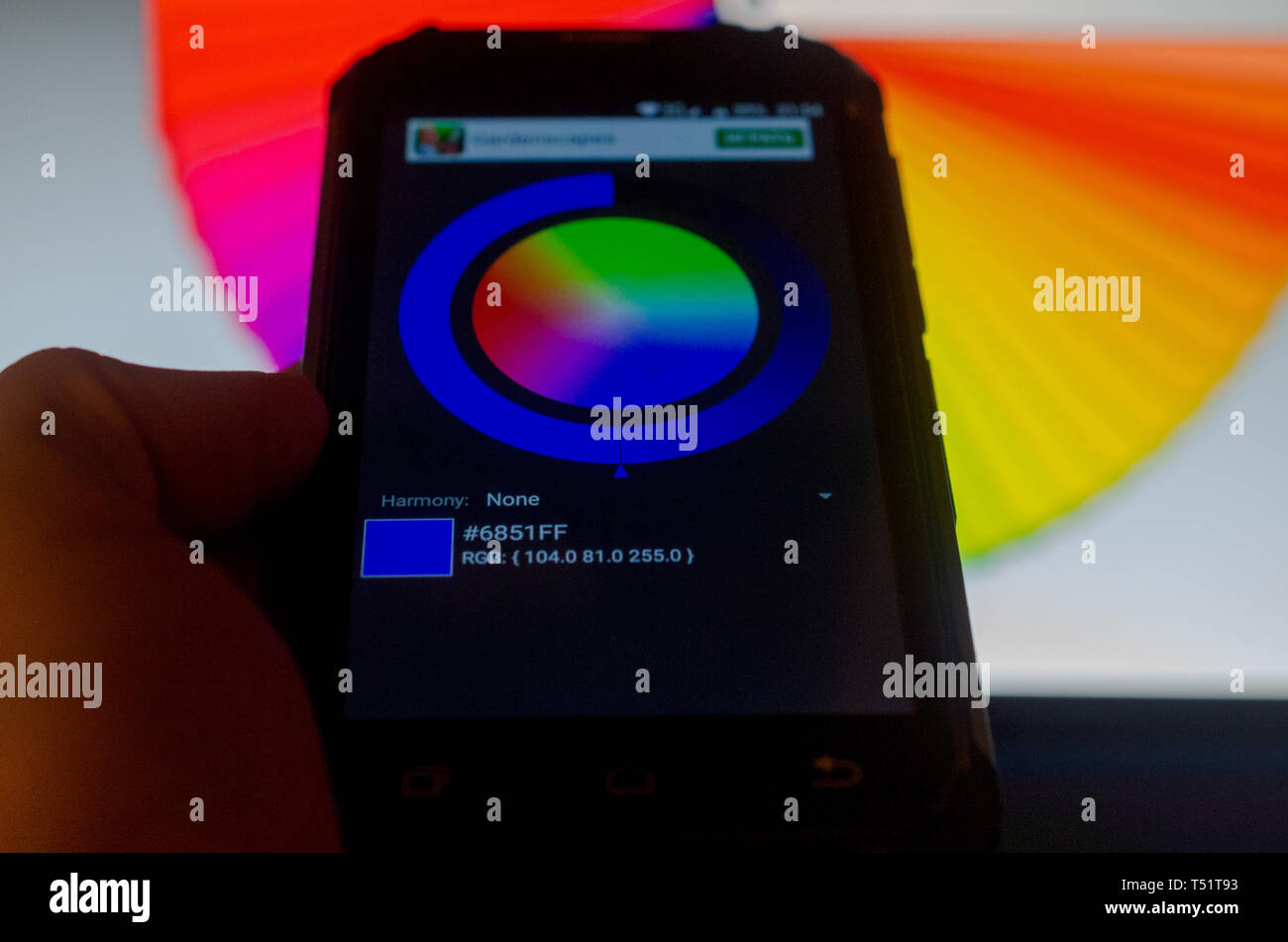 Electronic color palettes between a smartphone and a laptop Stock Photo