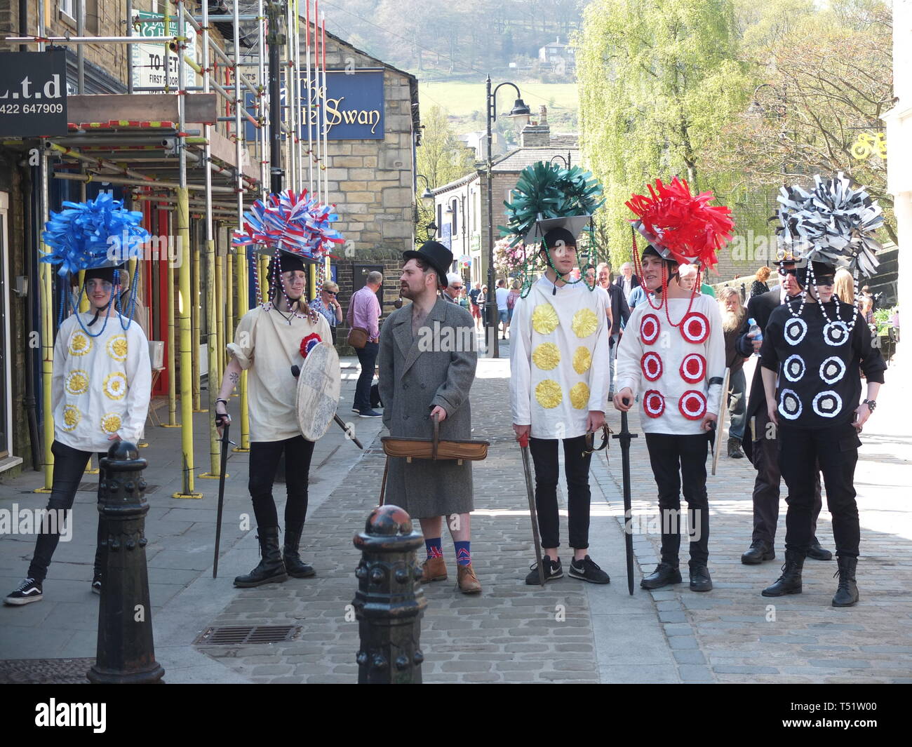 Young performers in traditional costume perform the Midgley Pace Egg Play at Hebden Bridge, a traditional mumming play in the Calder Valley Stock Photo
