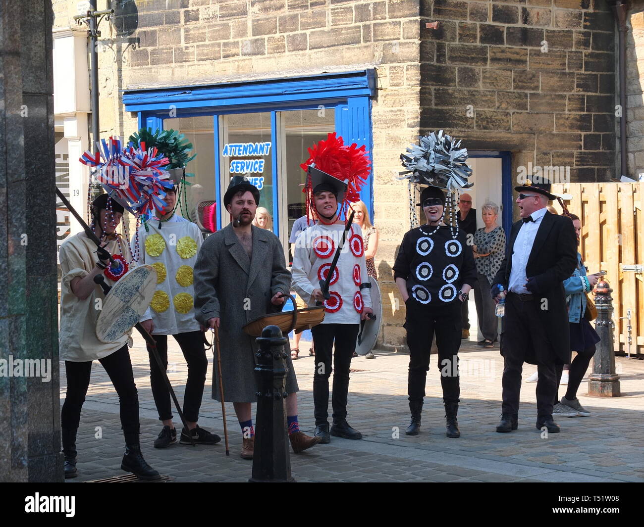 Young performers in traditional costume perform the Midgley Pace Egg Play at Hebden Bridge, a traditional mumming play in the Calder Valley Stock Photo