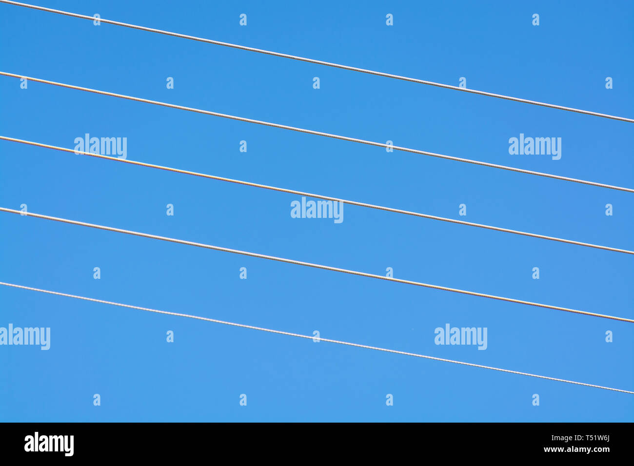 empty music staff concept photo of 5 electric wires on blue music staff template