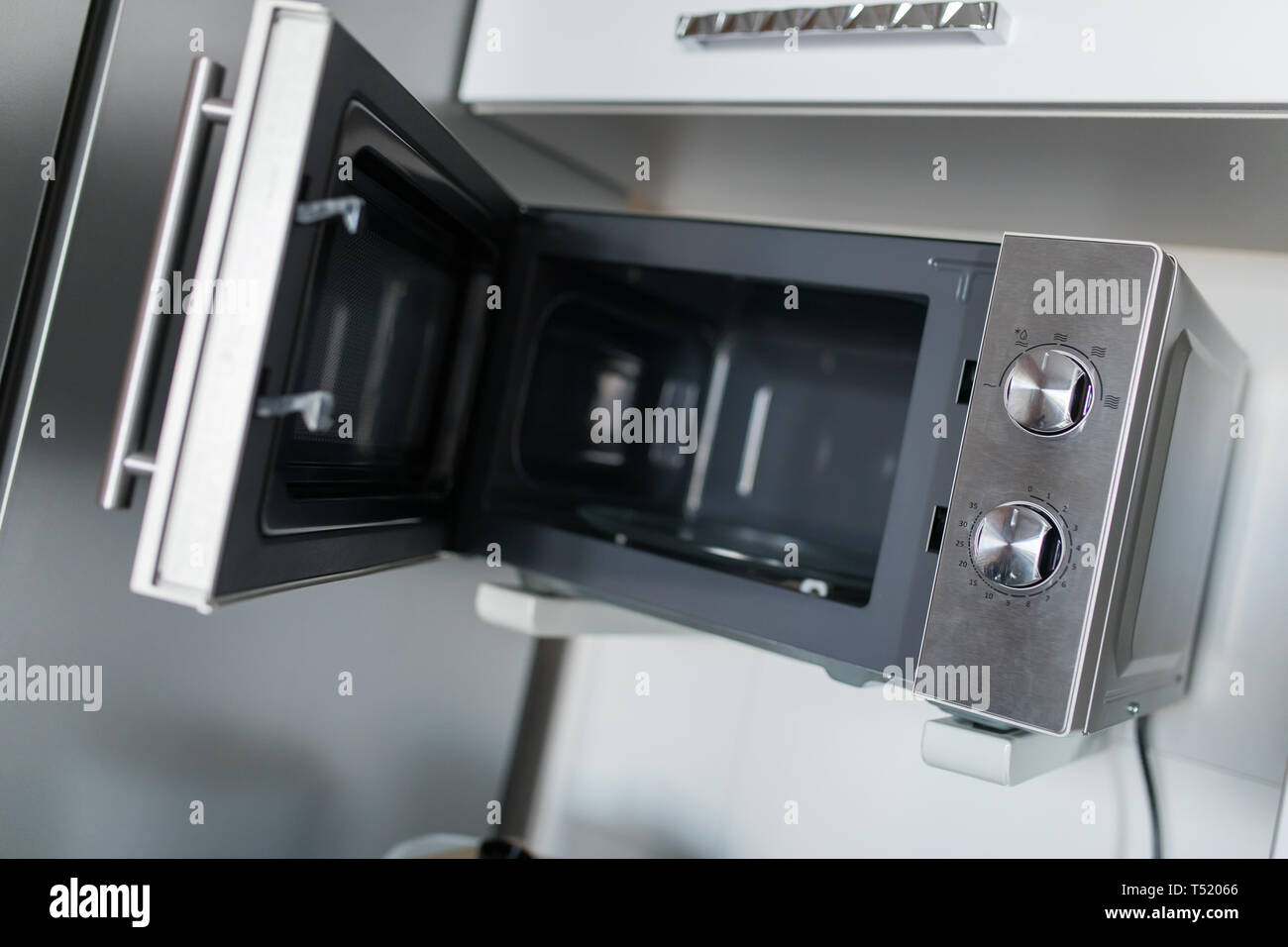 Empty microwave oven with open door Stock Photo Alamy