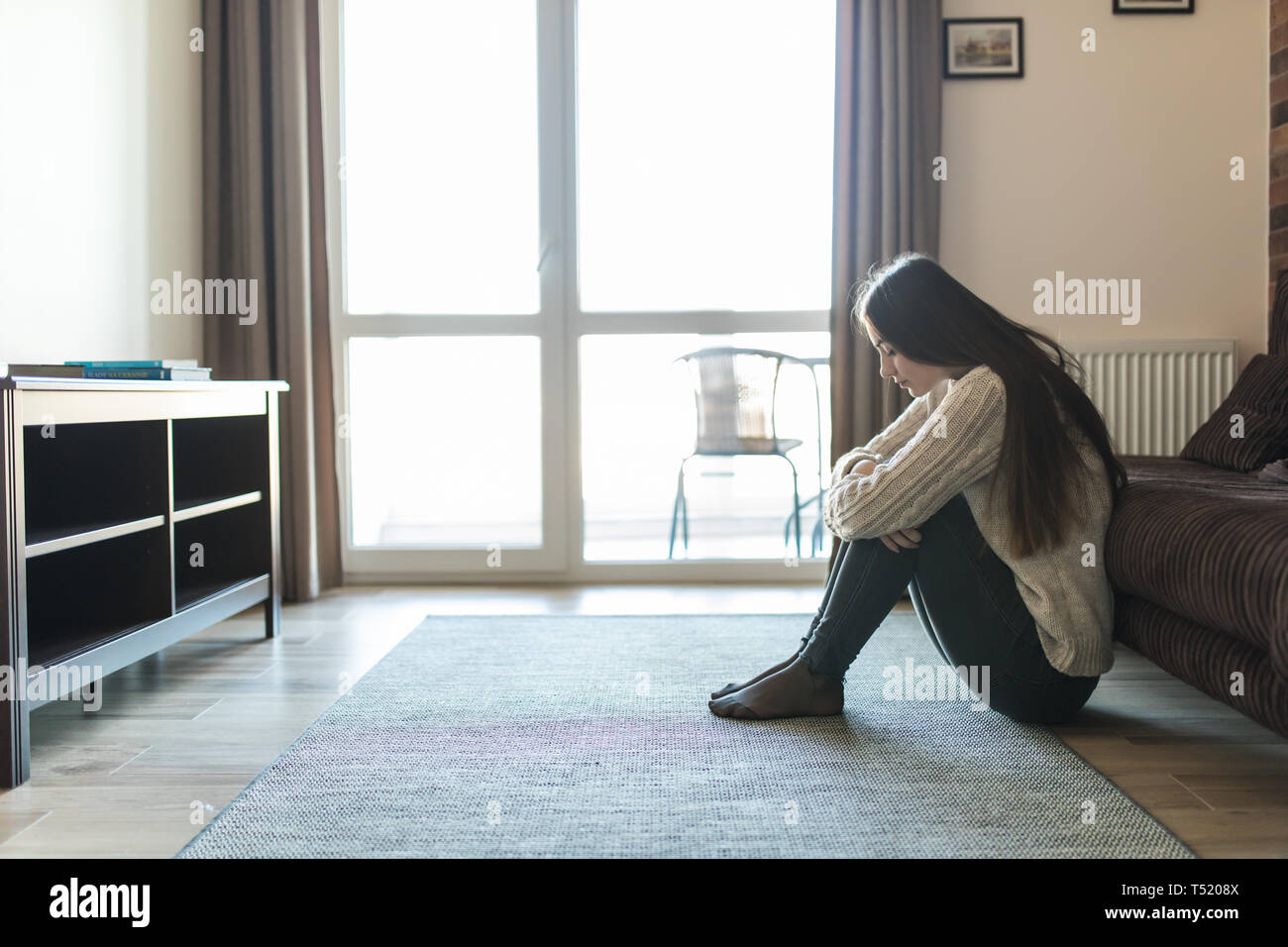 Siting alone hires stock photography and images Alamy