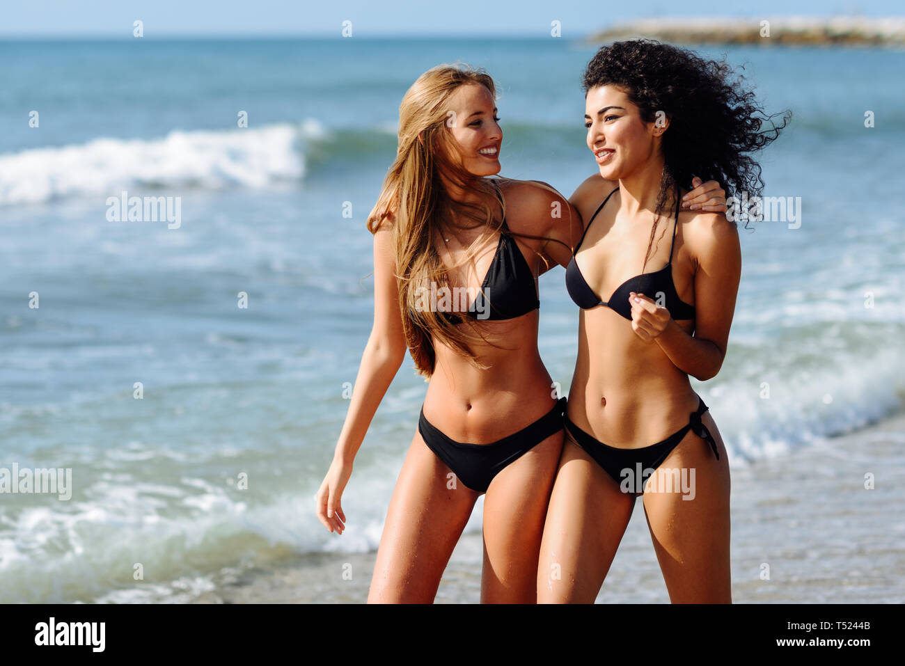 Two Young Women With Beautiful Bodies In Swimwear On A Tropical Beach Stock Photo Alamy