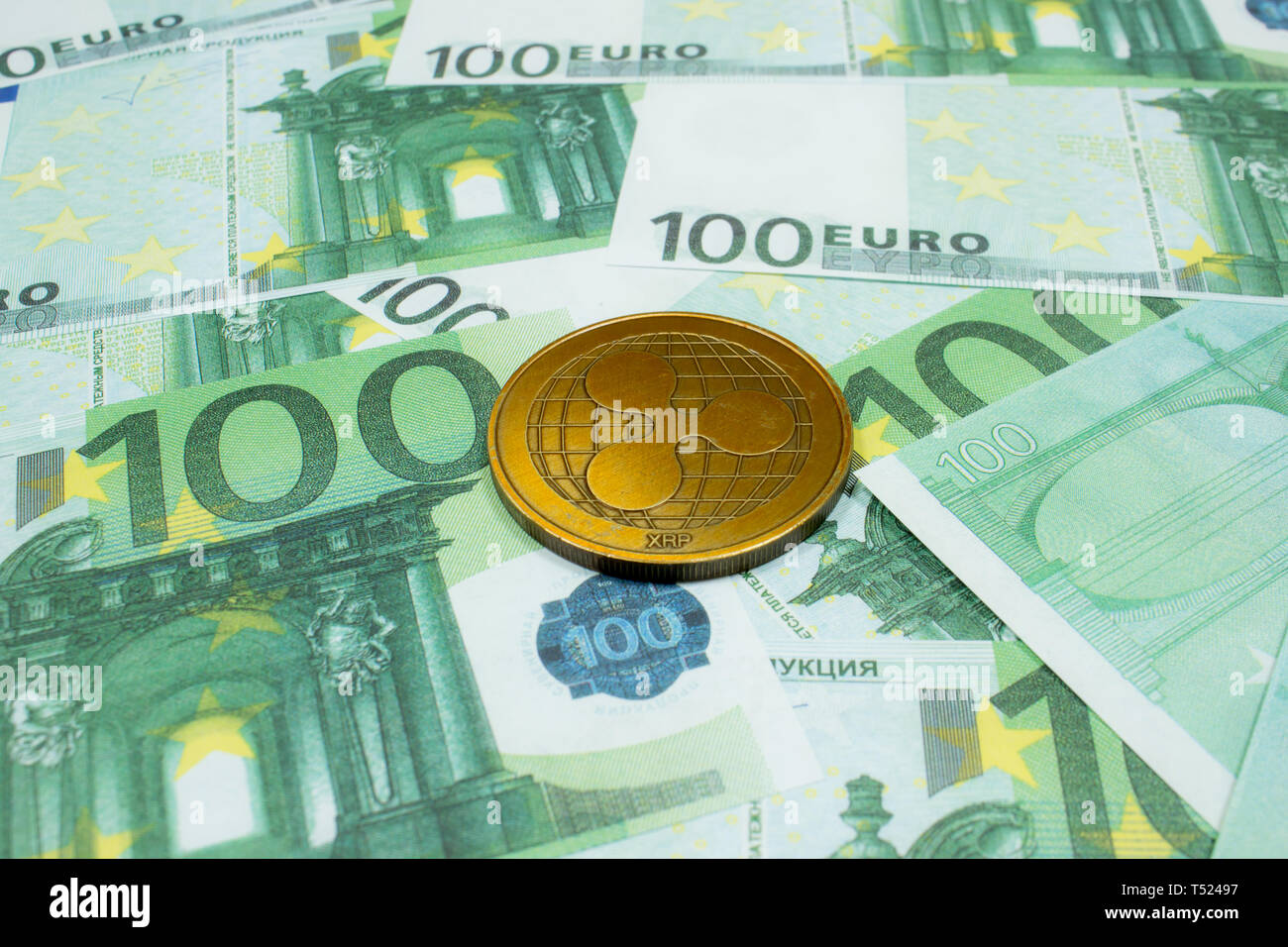 Ripple coin on 100 Euro banknotes close up. Crypto XRP Coin Stock Photo ...