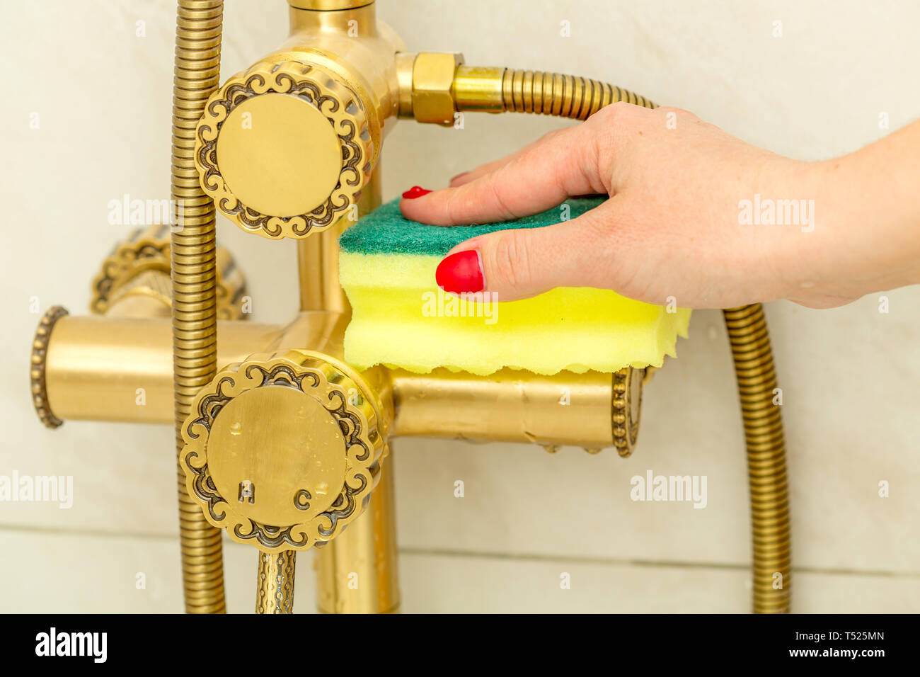Woman hand cleaning, modern tap in vintage style, water tap clean