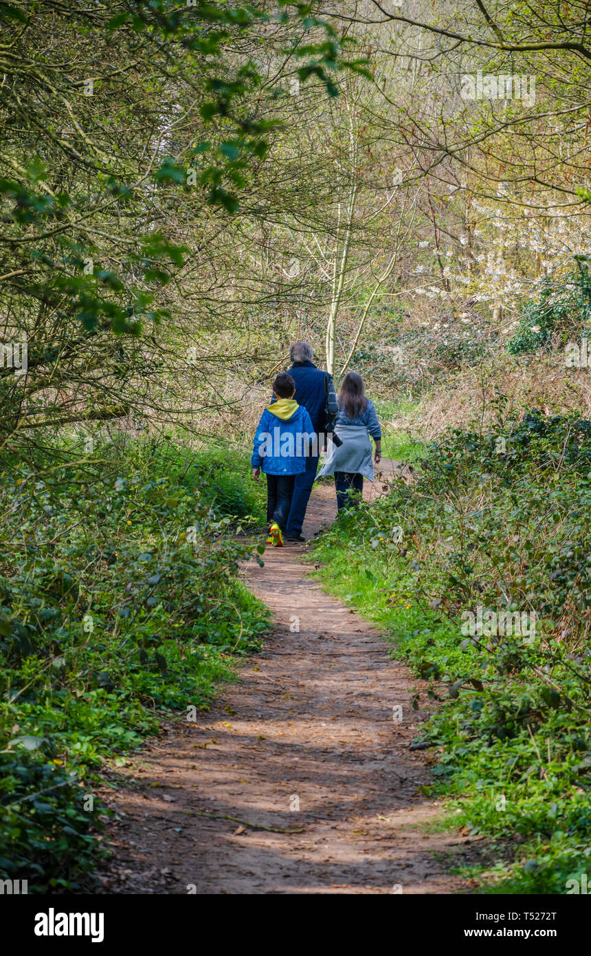 A family on a walk along country lanes at th evillage of Perton near Wolverhampton in South Staffordshire, UK Stock Photo