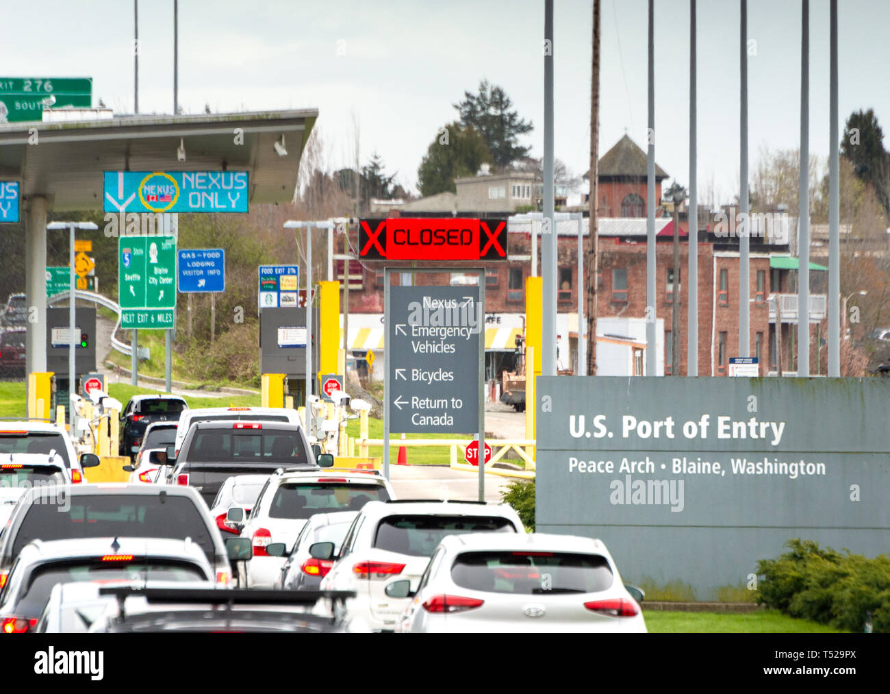 April 14, 2019 - Surrey, British Columbia: South bound vehicle lineup waiting to cross border at Peace Arch USA-Canada border inspection station. Stock Photo