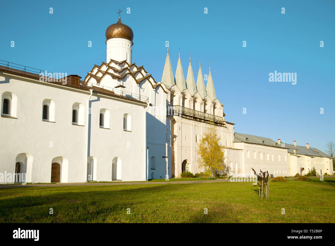 Belfry and Pokrovskaya Church of the Tikhvinsky Uspensky Monastery on a sunny October day. Tikhvin, Russia Stock Photo