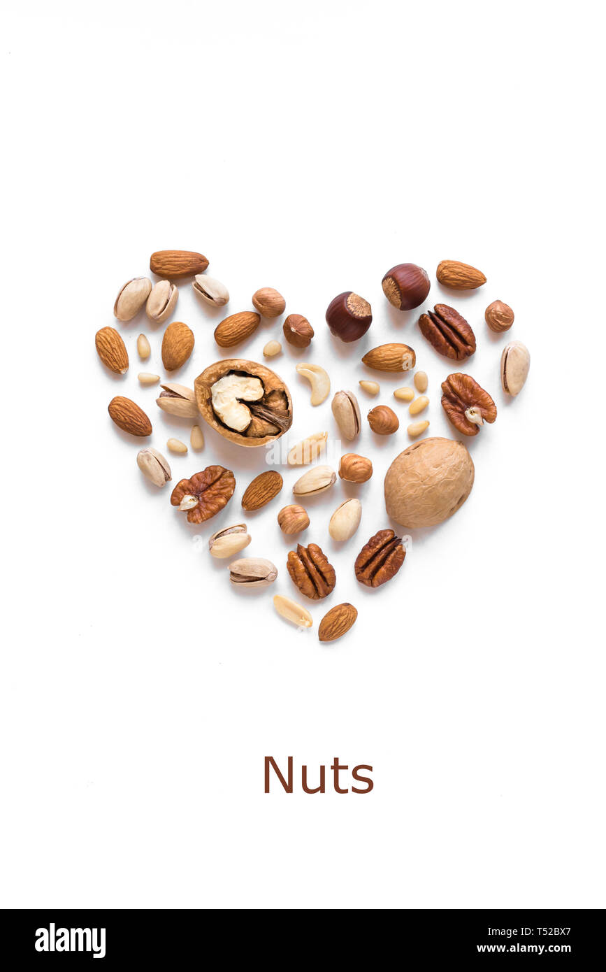 Nuts in shape of Heart isolated on white. Various nuts (almonds