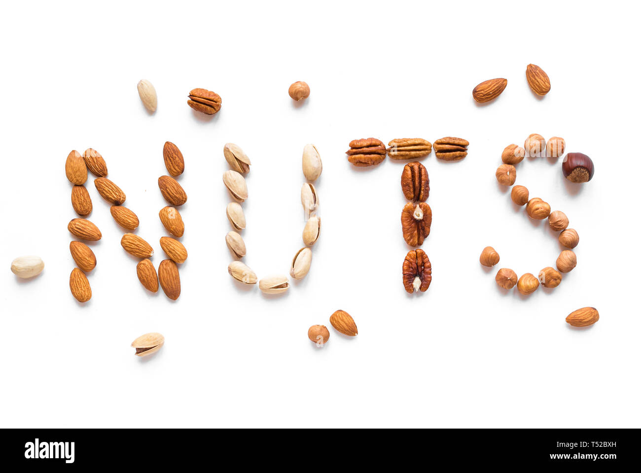 Nuts Spelling The Word Nuts isolated on white. Various nuts (almonds
