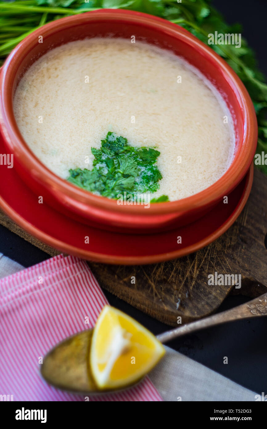 Traditional georgian chicken soup Chikhirtma with coriander and lemon