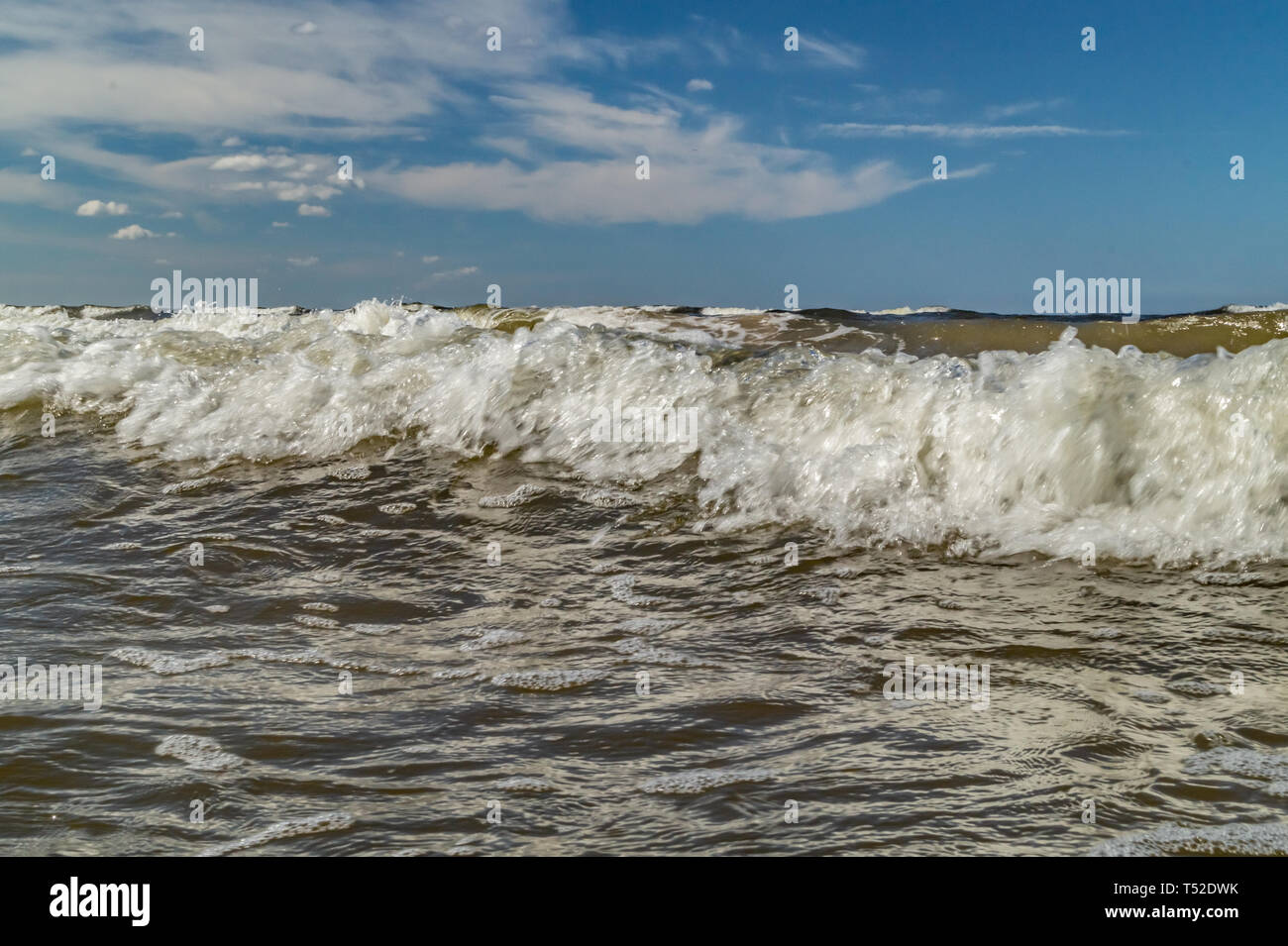 Landscape with sea waves and blue sky with white puffy clouds Stock ...