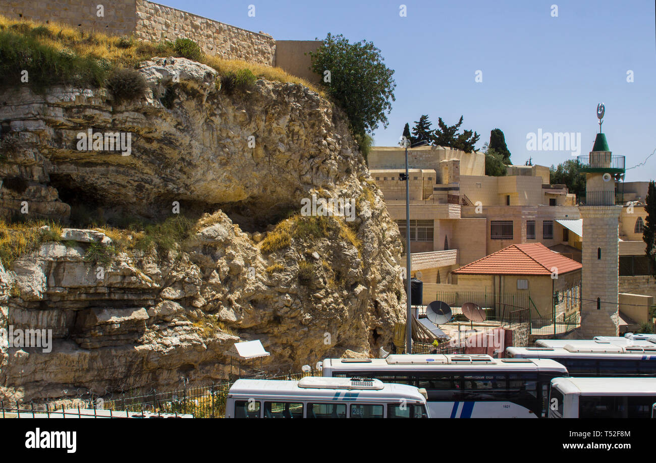 11 May 2018 The cliff face of Gordon's Calvary the place of the crucifiction of Jesus Christ with the modern bus station beneath in Jerusalem Israel Stock Photo
