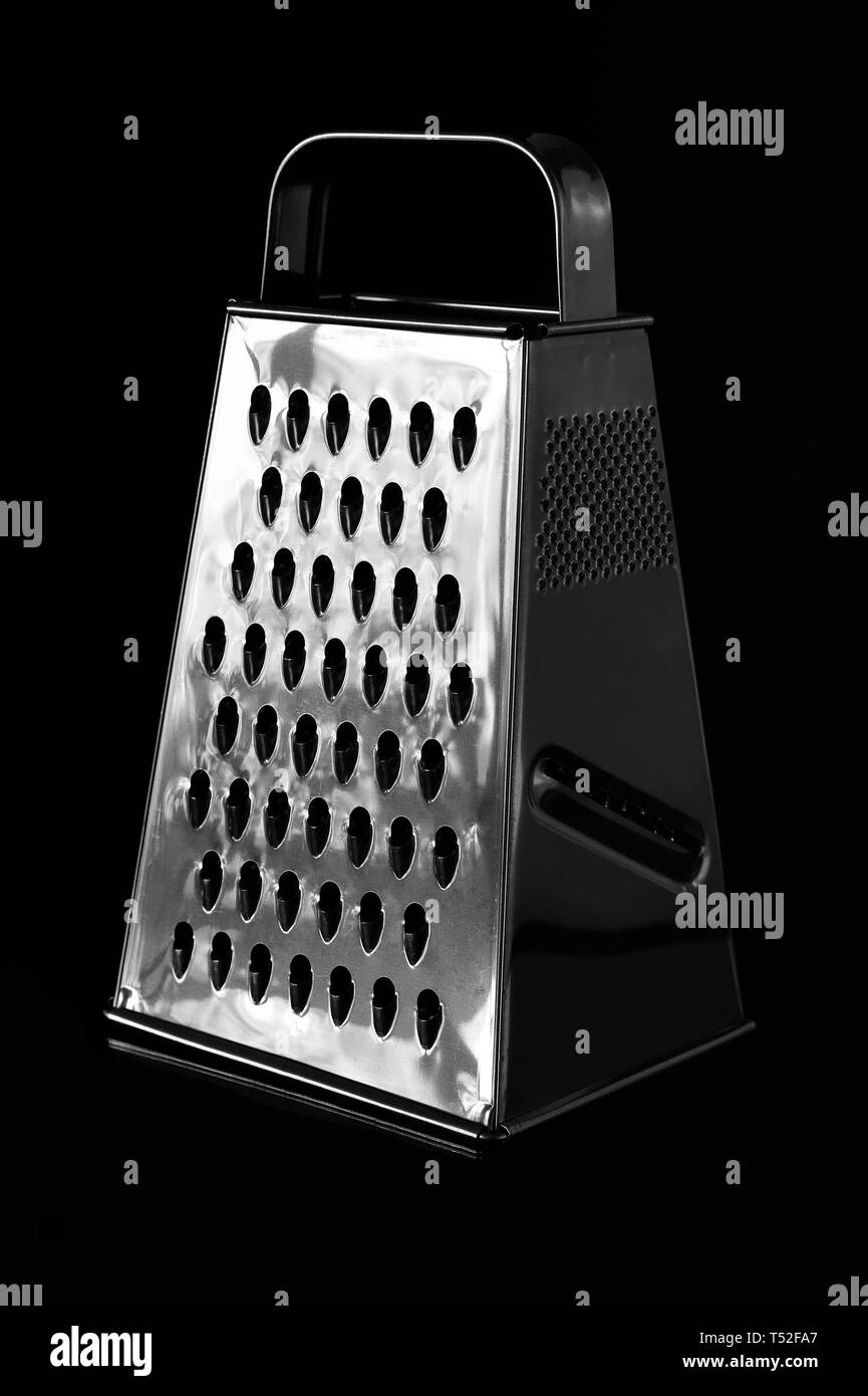 Metal grater with four different sides on black background Stock Photo