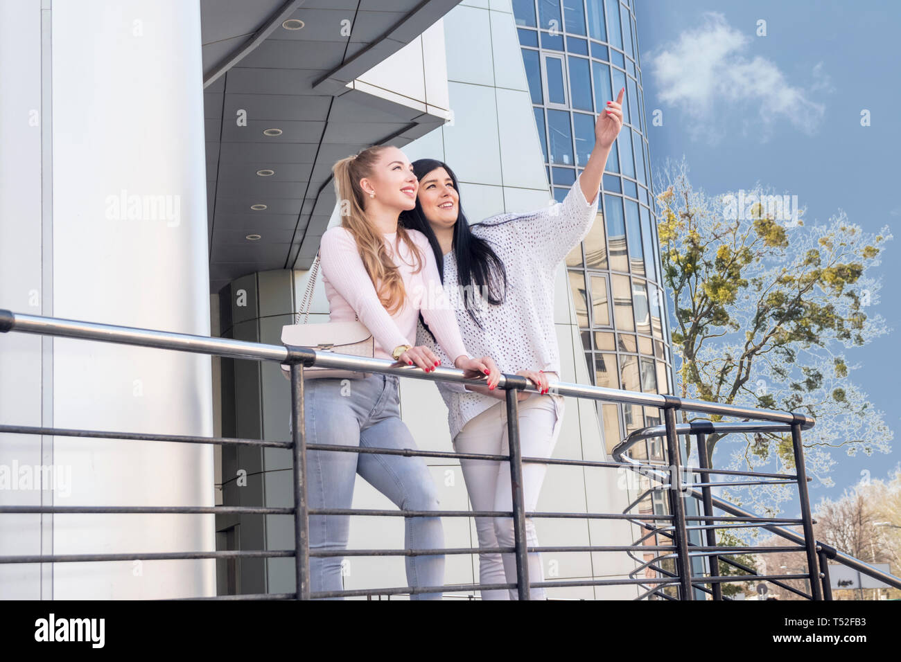 People Standing Behind Railing Woman standing behind railing hi-res stock photography and images - Alamy
