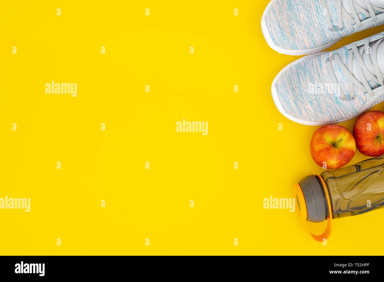 Download Fitness And Healthy Active Lifestyle Background Concept Training Sneakers Water Bottle And Apples On Yellow Background Top View With Space For Yo Stock Photo Alamy PSD Mockup Templates