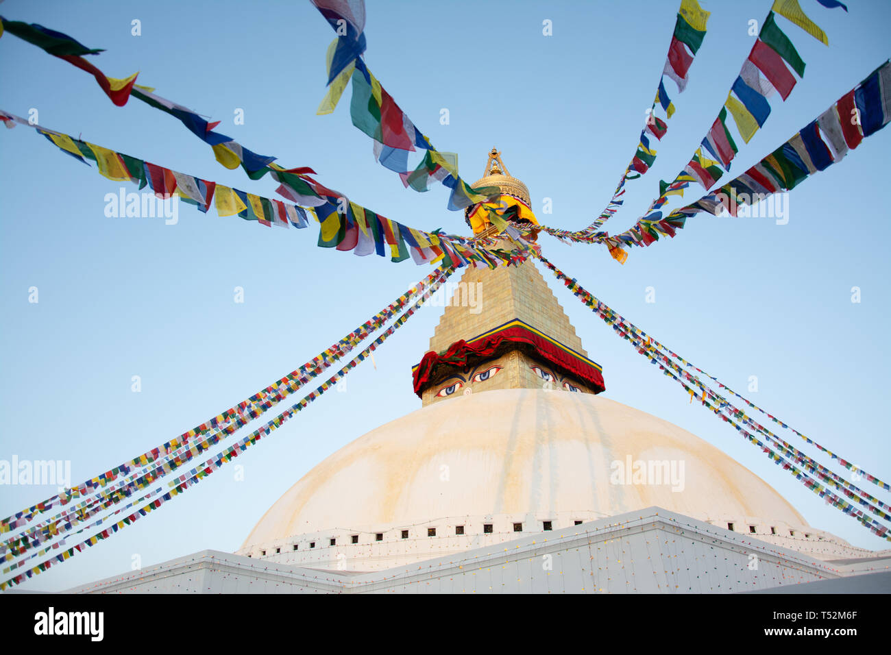 Kathmandu, Nepal - December 03, 2016: Bouddha stupa decorated with colourful prayer flags in Kathmandu. It is one of the largest stupas in the world. Stock Photo