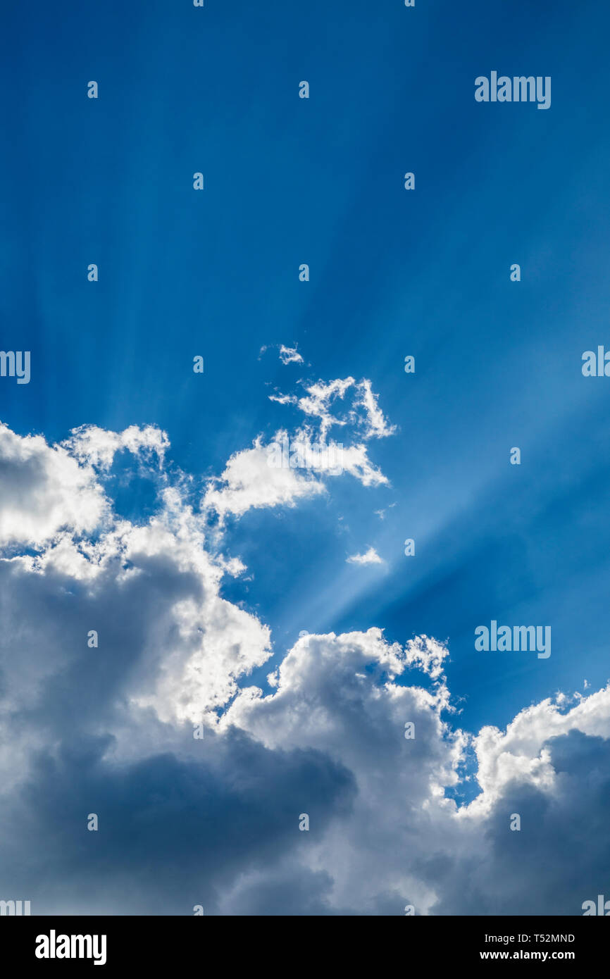 blue sky, clouds and sun rays Stock Photo